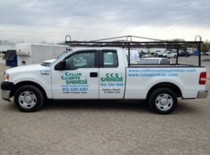 White work truck with vinyl decals for landscape company