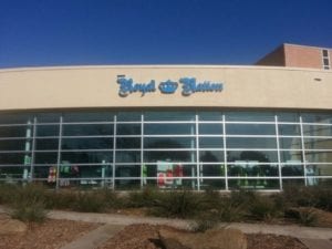 Blue storefront sign for Royal Nation