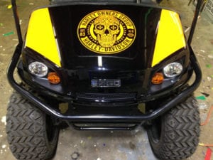 Black and yellow UTV with yellow Harley-Davidson skull decal